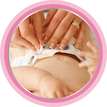 Using nappy cream before putting on a diaper.